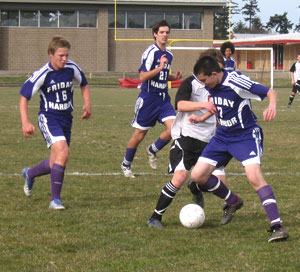Defender Mathew Skeels stops another offensive thrust by Coupeville.