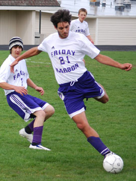 Pablo drives the ball upfield against Nooksack Valley High....