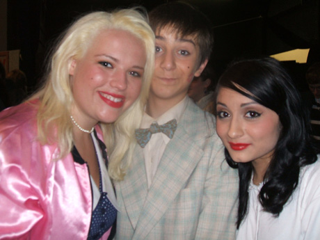 That's Sam Asher, with Emily Schultz (left) and Rhiannon Serna in last winter's "Grease."