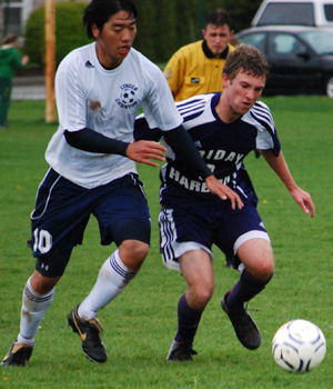 Conor Lanphere (right) wrestles the ball away from Lynden Christian
