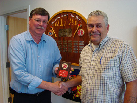  Fire Marshal Low (right) presenting Chief Marler with World Champion plaque