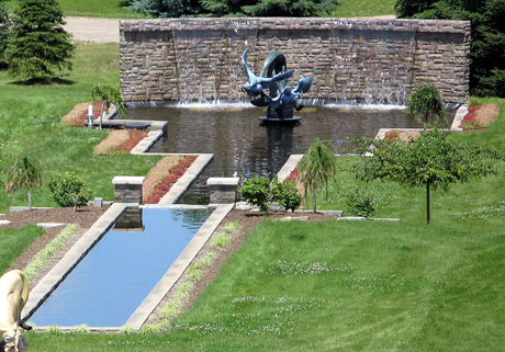 The bronze sculpture overlooks the reflecting pool....