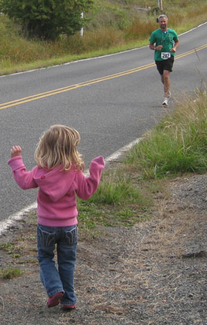 It's cool to see your dad coming around the corner, with two miles left to go....