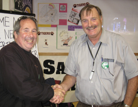 New superintendent Walt Wegener (right, shaking hands with me) was staffing the School District's booth at the Fair...
