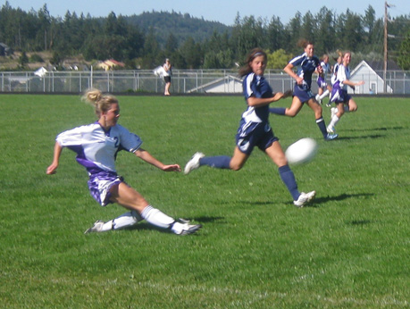 Emma Ytander crosses the ball in the second half to the left wing. She led FHHS with three goals on Saturday.