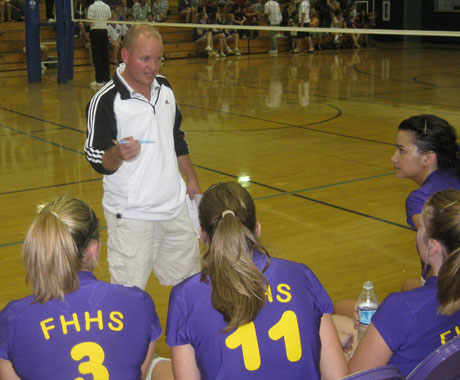 FHHS coach Travis Mager fires up the troops in Saturday's volleyball game...