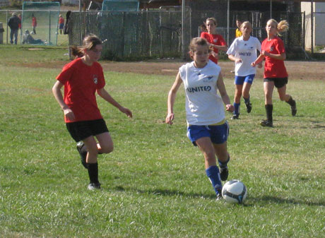 San Juan's U-14 girls (in red) lost to the visiting Mt. Baker squad Saturday, but played hard even in the last minutes of the game.