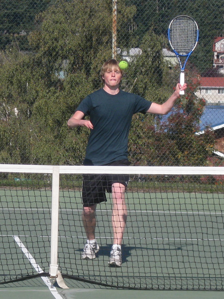 Senior Trevor Youngquist plays hard at the net during Saturday's match.