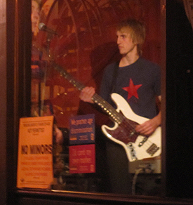 Bass player Grant Schwinge, in a moment of reflection (in the glass at Pazzo Vivo....)