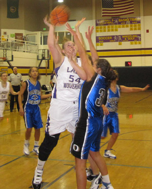 Friday Harbor center Kelsey Barnes drives to the hoop in the first half against the Vikings...