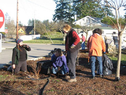Volunteers working (and chatting) on the grounds of the Mullis Center. Photo by Janet Thomas.