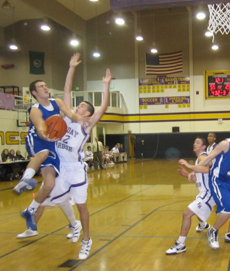 Wolverine Elliot Howard forces Orcas to the baseline in the second half of the FHHS victory...
