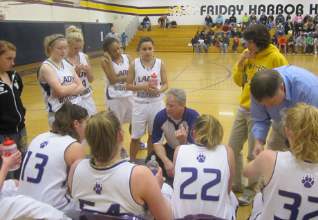 FHHS head coach Eric Jangard keeps the girls fired up against Meridian last Saturday. The girls won 60-41 to set up tomorrow's playoff game at Coupeville.