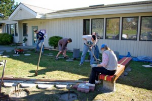 Making it happen: Brad Fincher (left), Sam McMain, Sam Buck (behind), John McMain and Jane Buck as new benches are being installed and stepping stones are being set.