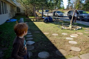 Kindergartner Luke (he's in Ms. Minke's class) looks over the work done last week when it was sunny....