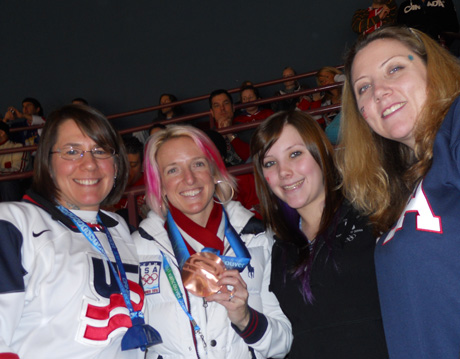 Lainey Volk and her family got their photo taken with bronze-medal moguls winner Shannon Bahrke at the Swiss/USA hockey game. That's Becky Volk, Shannon, Deanna ( Lainey’s granddaughter), and Cristine (Lainey’s daughter). Photo by (you guessed it!) Lainey.