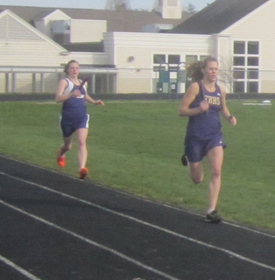 Kia Johns widens her lead in the 800 relay yesterday....