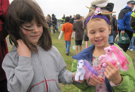 Lilah (left) and Indigo compare ponies after the egg hunt on Jackson's Beach on Easter.