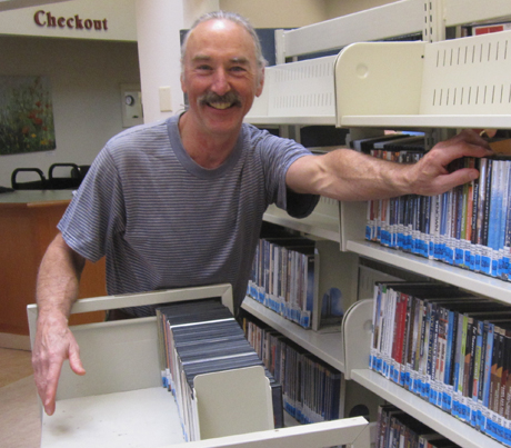 Last weekend, volunteers like Gary Roberts helped move the books & movies so the Library could re-do the floor this week...they're making good progress & plan to re-open on Monday, so you can see the new floor!