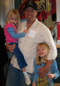 Presley & McKenna greet Ken Clark at his surprise birthday party at Xtreme Fitness last weekend...photo by Sophie Rice for the Update