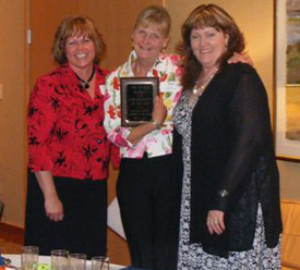 Award to The Whale Museum. (l to r) Vernadel Peterson, Executive Director SJI Chamber; Nan Simpson, Board member of The Whale Museum; Julie Corey, President SJI Chamber.