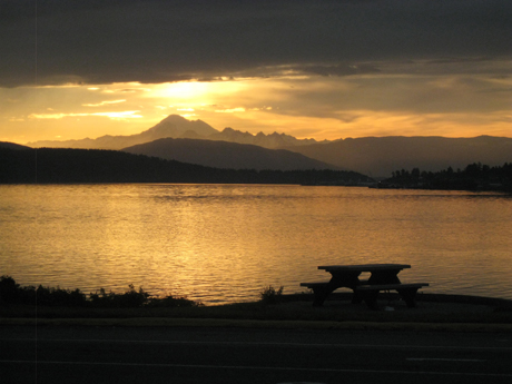 Coming home: Early morning in the Anacortes ferry line, with the sun over Mount Baker. Photo by Ian Byington.