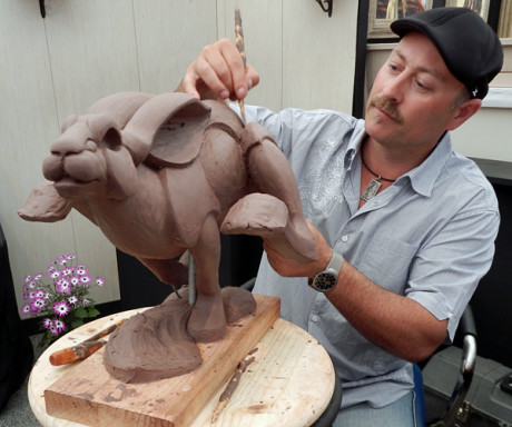 Jason Napier puts the last touches on a new sculpture - "Hareborne" - for the Arizona Fine Arts Festival this week....