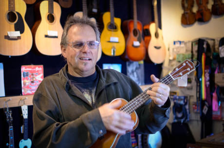 Kirk is quick with a song on the ukulele in his music store, Isle Be Jammin' - Tim Dustrude photo