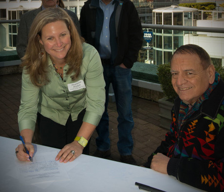 Stephanie Buffum of FRIENDS of the San Juans signs the International Treaty to Protect the Sacred with Chief Phil Lane of the Ihanktonwan Dakota and Chickasaw Nations at the Safe Shipping in the Salish Sea Conference on March 22nd - Paul Anderson photo
