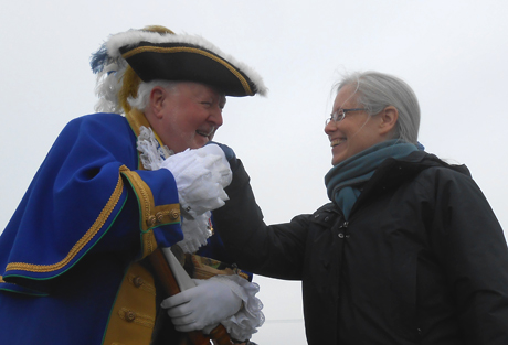 Sidney, British Columbia's town crier Kenny Podmore greets Friday Harbor mayor Carrie Lacher on Sunday as Washington State Ferries's Anacortes/Friday Harbor/Sidney run opened for the year. The once-a-day ferry route (twice-a-day during the summer) connects the neighboring countries.