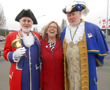 Sidney's Member of Parliament (and head of the national Green Party) Elizabeth May offered rousing assurance that she would work with the government in Canada to protect and preserve the international ferry run. She is joined by the two Canadian town criers (Victoria's Robert Alexander, left, and Sidney's Kenny Podmore) at the celebration Sunday.