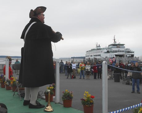 Anacortes town crier Richard Riddell thanks the Sidney crowd for their hospitality, at Sunday's celebration in Sidney, BC of the opening of the international run for Washington State Ferries.