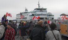 Canadians in Sidney, BC turn out to greet the arrival of the Chelan on Sunday.
