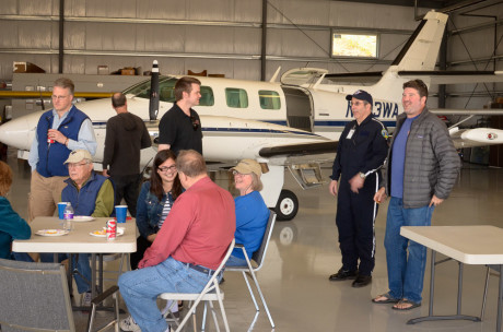 Folks milling around the hangar, swapping flying stories, eating delicious barbecued tri-tip steak and generally having a good time