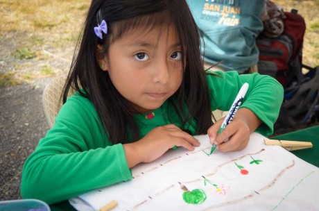 Over at the SJI Prevention Coalition booth, a budding artist decorates her T-shirt