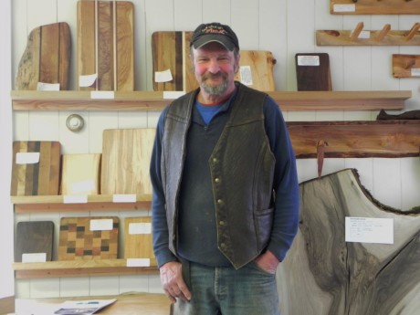 Rick Waldron stands in front of his beautiful wood handiwork over at The Board Room on Tucker - Contributed photo