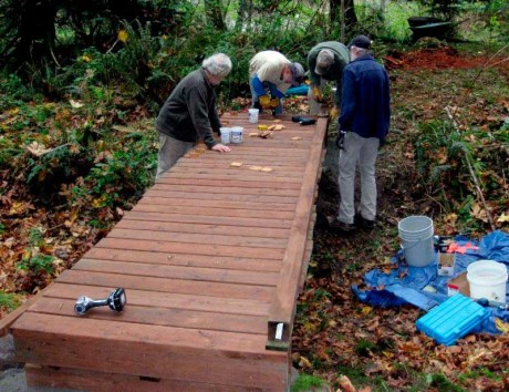 Park volunteers install a puncheon on the Bell Point-Westcott Bay trail - SJINHP photo
