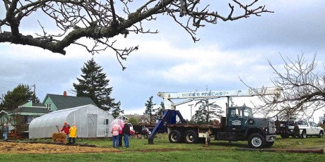 Marty Ahart, Black Family Enterprises and volunteers prepare to move the greenhouse to its new home - Louise Dustrude photo