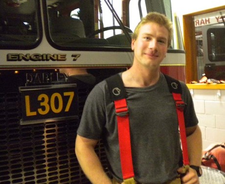 Brandon Baney pictured here in front of his favorite fire truck, Ladder 317 - Sheila Harley photo