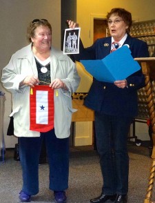 Minnie Knych presents Mamie Forbes with the Blue Star