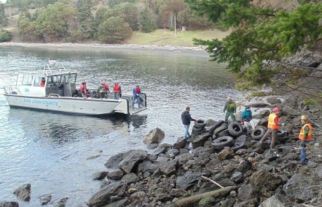County crew removes tires from Deadman Bay area shoreling - SJ County staff photo