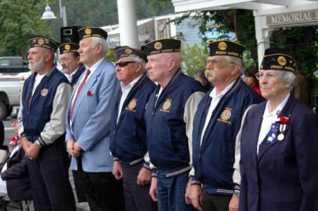 Proud Veterans stand in honor of service, Left to right: Jim Capron, Karl Mueller, Don Madden, Bobby Boyce, Carl Robinson, Jerry Beirschmidt, BJ Miner - Contributed photo