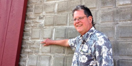 Boyd Pratt with cement blocks of two different patterns on the old Friday Harbor Brick & Tile Co., today's Brickworks