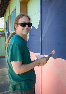 R. Von Plowman, working the mural at FH Pet Supplies - SJ Update photo