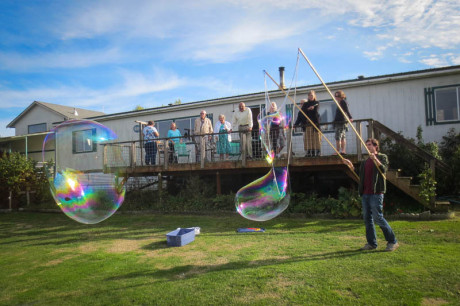 Marc Franklin makes giant soap bubbles for the celebration - Tim Dustrude photo