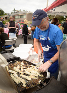 Kerwin Johnson cooks up some delicious Cod at last May's Fish Taco event at the Ace Hardware parking lot - Tim Dustrude photo