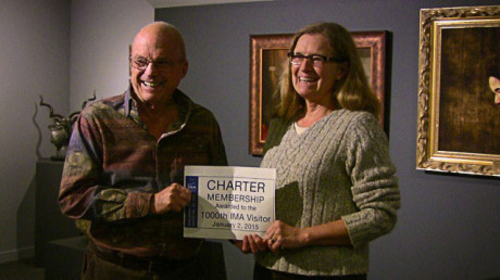 Erin Braybrook of Arlington, formerly of San Juan Island, accepts her prize from museum director Charlie Bodenstab - Contributed photo