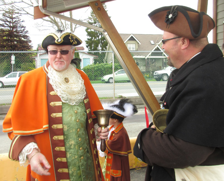 Town criers Kenny (from Sidney) and Richard (from Anacortes, who also handled the ferry's PA announcements on the ride over) get ready to announce the cutting of the ribbon. Photo: Ian Byington/San Juan Update