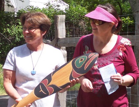 Dianna Down and Sydney Exton with commemorative paddle - Photo by Nancy Way, The Watership Company, West Beach Creek project contractor
