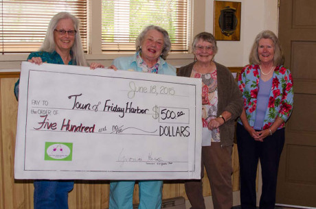 Town accepts a check for $500 from the Club to help care for flower baskets. L-R: Mayor Carrie Lacher, Garden  Margarite Bennett, Vonnie Harold and Dot Vandaveer - Tim Dustrude photo